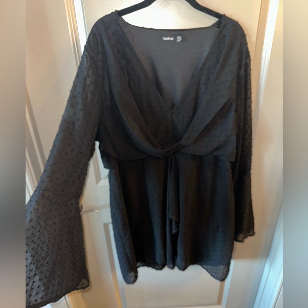 Long sleeve black dress with a dot texture
